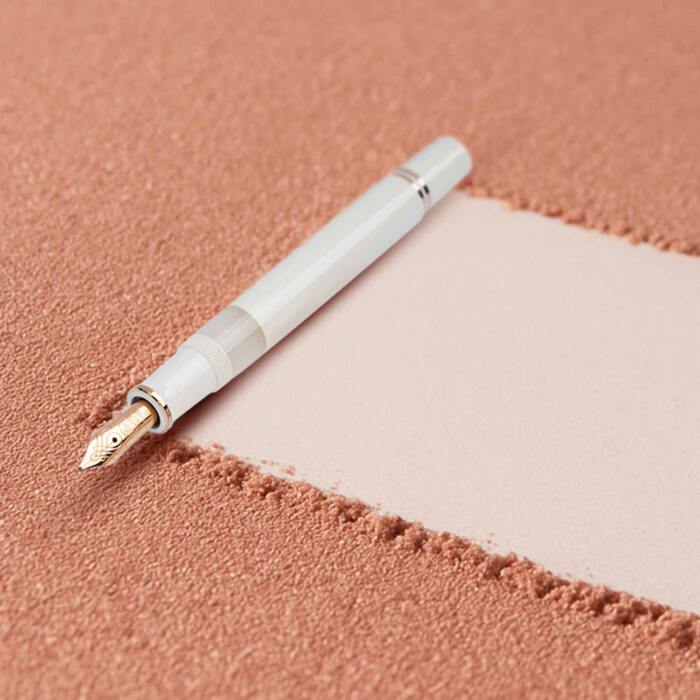 Pelikan-M600-white-and-rose-gold-fountain-pen-uncapped-nibsmith-1